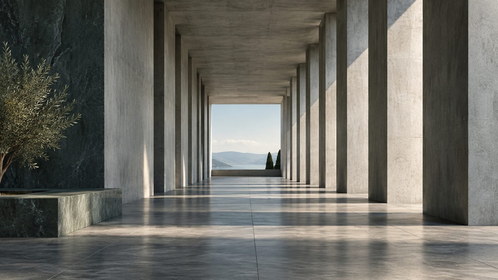 A long architectural colonnade framed by light